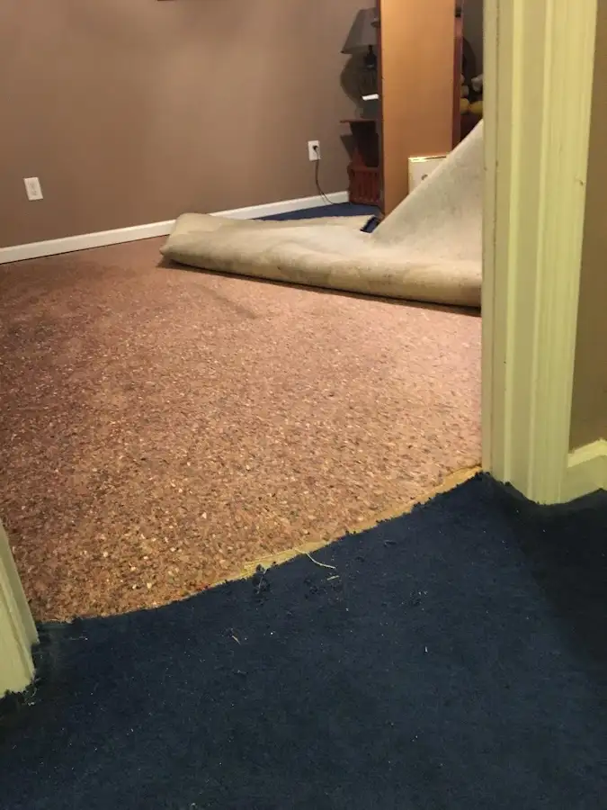 Carpet pad removal revealing water damage during Drying & Dehumidification in East Foothills