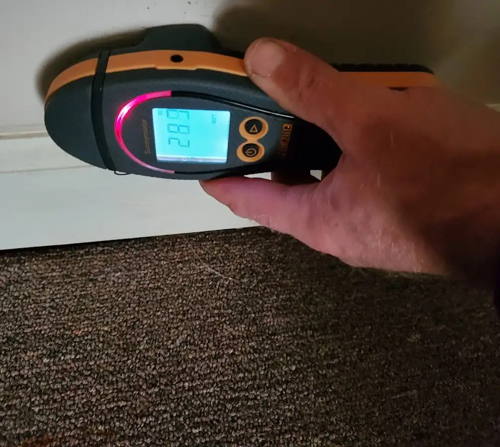 Moisture detection at baseboard during Storm Damage Restoration in East Foothills